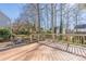 An outdoor wooden deck and patio with an outdoor kitchen and a view of the backyard at 16115 Chiltern Ln, Huntersville, NC 28078