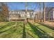 Expansive backyard with lush lawn and deck, perfect for outdoor entertaining and relaxation at 16115 Chiltern Ln, Huntersville, NC 28078