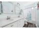 Charming bathroom with a double vanity and a bathtub shower combo with a colorful curtain at 16115 Chiltern Ln, Huntersville, NC 28078