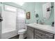 Bright bathroom featuring a shower and tub combination, modern vanity, and a decorative mirror at 16115 Chiltern Ln, Huntersville, NC 28078