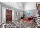 Spacious entryway with a large front door, high ceilings, and hardwood flooring at 16115 Chiltern Ln, Huntersville, NC 28078