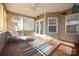 Cozy screened porch featuring a ceiling fan and comfortable seating, perfect for relaxing outdoors at 16115 Chiltern Ln, Huntersville, NC 28078