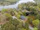 Aerial view of lakeside home with surrounding trees and dock access at 1614 Fieldbrook Ln at 1614 Fieldbrook Rd, Rock Hill, SC 29732