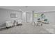 Spacious finished basement with a seating area and carpeted floors at 1614 Fieldbrook Rd, Rock Hill, SC 29732