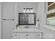 Stylish bathroom featuring a marble countertop vanity, decorative mirror and modern lighting at 1614 Fieldbrook Rd, Rock Hill, SC 29732