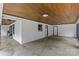 Spacious carport featuring a wooden ceiling, ample lighting, and access doors at 1614 Fieldbrook Rd, Rock Hill, SC 29732