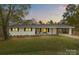 Charming single-story home featuring a welcoming front porch and an attached carport in a serene setting at 1614 Fieldbrook Rd, Rock Hill, SC 29732