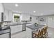 Spacious kitchen featuring white cabinets, gray counters, a center island, and stainless steel appliances at 1614 Fieldbrook Rd, Rock Hill, SC 29732