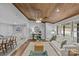 Inviting living space with a wood ceiling, opening to a dining area and featuring modern decor and natural light at 1614 Fieldbrook Rd, Rock Hill, SC 29732
