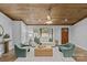Well-lit living room with neutral tones, hardwood flooring, and minimalist decor under a wood ceiling at 1614 Fieldbrook Rd, Rock Hill, SC 29732