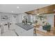 Open concept living space with wood ceiling, living room seating, dining space, and a kitchen island at 1614 Fieldbrook Rd, Rock Hill, SC 29732