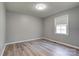 Clean, empty bedroom with neutral walls, light flooring, and natural light from the single window at 200 South Fork Dr, Shelby, NC 28152