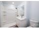 Clean, updated bathroom with white fixtures, modern vanity, and shower with white shower surround at 2005 Douglas Rd, Lancaster, SC 28720