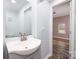 Bright bathroom featuring a modern sink and mirror, conveniently located near the bedroom at 2005 Douglas Rd, Lancaster, SC 28720