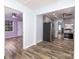 Open layout showing kitchen with stainless appliances connected to adjacent rooms with beautiful flooring at 2005 Douglas Rd, Lancaster, SC 28720