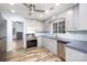 Grey kitchen featuring stainless steel appliances, a ceiling fan, and wood-look flooring at 2005 Douglas Rd, Lancaster, SC 28720