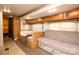 Cozy RV interior featuring booth seating, a sofa, and built-in cabinets at 2005 Douglas Rd, Lancaster, SC 28720