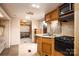 RV kitchen with modern appliances, including a stove, microwave, and sink at 2005 Douglas Rd, Lancaster, SC 28720