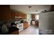 Cozy kitchen with oak cabinets, white appliances, and tile backsplash at 211 Honeycutt Rd, Troutman, NC 28166