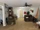 Spacious living room with comfortable seating, ceiling fan, and ample natural light at 211 Honeycutt Rd, Troutman, NC 28166