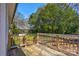Back deck featuring natural wood and railing steps that lead to a grassy backyard, perfect for outdoor living at 248 Kerr Nw St, Concord, NC 28025