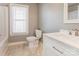 Neutral bathroom with a single sink vanity, toilet, and bathtub, all illuminated by natural light at 248 Kerr Nw St, Concord, NC 28025