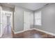 Bedroom with sleek hardwood floors, a window for natural light, and a neutral paint scheme at 248 Kerr Nw St, Concord, NC 28025