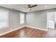 Cozy bedroom with hardwood floors, natural light, and proximity to the laundry area at 248 Kerr Nw St, Concord, NC 28025