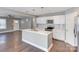 Well-equipped kitchen with stainless steel appliances, a kitchen island, and white cabinets at 248 Kerr Nw St, Concord, NC 28025