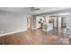 Spacious living room showcases hardwood floors and an open floor plan with kitchen views at 248 Kerr Nw St, Concord, NC 28025