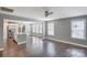 Open concept living room with hardwood floors leading to a modern kitchen and dining area at 248 Kerr Nw St, Concord, NC 28025