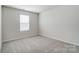 Bedroom showcasing carpet, a window, and neutral paint at 2639 Tillman St, Monroe, NC 28112