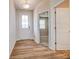 Inviting entryway featuring wood-look flooring and a view into the adjacent room at 2639 Tillman St, Monroe, NC 28112