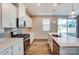 Stylish kitchen featuring stainless steel appliances, quartz countertops and white cabinetry at 2639 Tillman St, Monroe, NC 28112