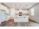 Modern kitchen with white cabinets, stainless steel appliances, and a large island at 2639 Tillman St, Monroe, NC 28112