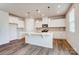 Bright, open kitchen featuring a large island, stainless steel appliances, and modern pendant lighting at 2639 Tillman St, Monroe, NC 28112