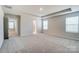Bright, carpeted main bedroom with recessed lighting and windows to let the light in at 2639 Tillman St, Monroe, NC 28112