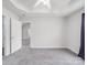 Bedroom with high ceilings, large window, neutral paint, gray flooring and an ensuite bathroom at 314 Sugar Creek Xing, Fort Mill, SC 29715