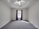 Bedroom featuring carpet flooring, large window with privacy blinds and neutral paint at 314 Sugar Creek Xing, Fort Mill, SC 29715