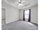 Bedroom with high ceilings, large window, neutral paint, gray flooring and an ensuite bathroom at 314 Sugar Creek Xing, Fort Mill, SC 29715