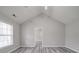 Bedroom with high ceilings, large window, neutral paint, gray flooring and an ensuite bathroom at 314 Sugar Creek Xing, Fort Mill, SC 29715