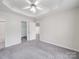 Bright bedroom boasts neutral paint, updated ceiling fan, and plush carpeting at 314 Sugar Creek Xing, Fort Mill, SC 29715