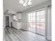 Eat in kitchen featuring modern flooring, slider doors to the deck, and stylish flooring, perfect for entertaining and Gathering meals at 314 Sugar Creek Xing, Fort Mill, SC 29715