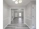 Open entryway with neutral paint, gray flooring and view into living room with front door at 314 Sugar Creek Xing, Fort Mill, SC 29715
