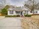 Charming single-story home featuring a well-manicured lawn and a welcoming front porch, perfect for enjoying the outdoors at 314 Sugar Creek Xing, Fort Mill, SC 29715