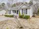 Charming single-story home featuring a well-manicured lawn and a welcoming front porch, perfect for enjoying the outdoors at 314 Sugar Creek Xing, Fort Mill, SC 29715
