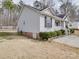 Charming single-story home with light siding, dark shutters, and well-maintained landscaping at 314 Sugar Creek Xing, Fort Mill, SC 29715