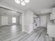 Bright kitchen showcasing updated flooring, white cabinets, and essential appliances, creating a functional and inviting space at 314 Sugar Creek Xing, Fort Mill, SC 29715