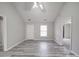 Spacious living room featuring updated flooring, natural light and ample space for furniture, ideal for relaxation and entertaining at 314 Sugar Creek Xing, Fort Mill, SC 29715