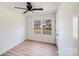 Bright bedroom with natural light, neutral walls, ceiling fan and hardwood floors at 327 Berry St, Rock Hill, SC 29732